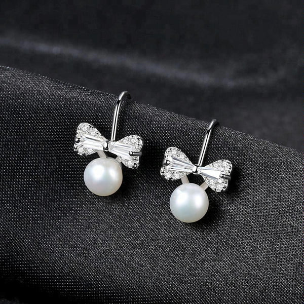 Sterling Silver Small Ribbon Natural Pearl Studs - Enumu